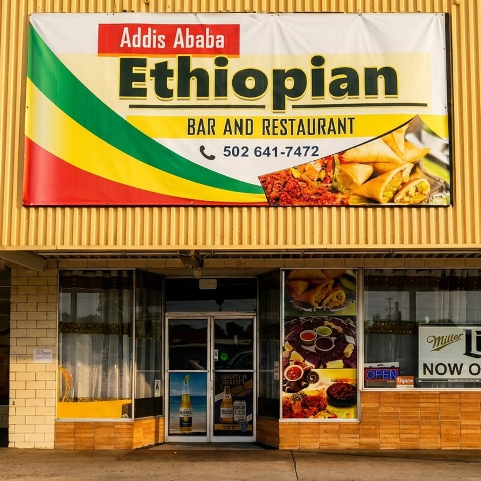 The exterior of Addis Ababa Ethiopian Bar and Restaurant with a large sign and window displays.